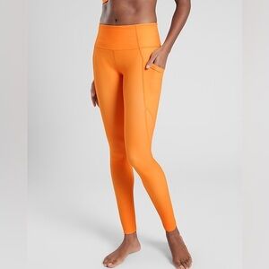 Athleta Salutations Stash Pocket Tight Full Length Neon Orange Leggings  size XS